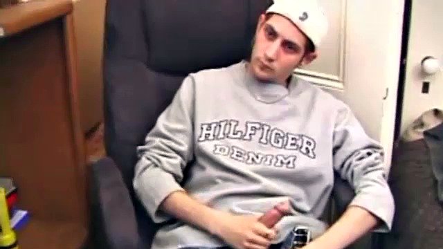 While playing a porn video, Aaron strokes himself hard and then pulls his dick out of his jeans. After a good long stroking show, this young man lets loose and spills his hot sticky cum all over the bed.