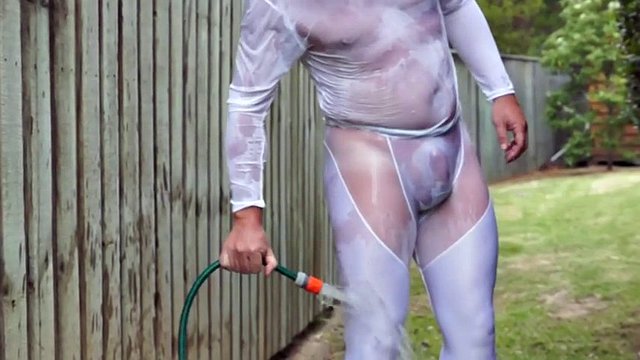 A man in a wet white spandex