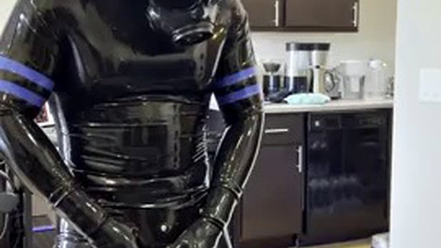 Rubberdrone jerks off in latex socks