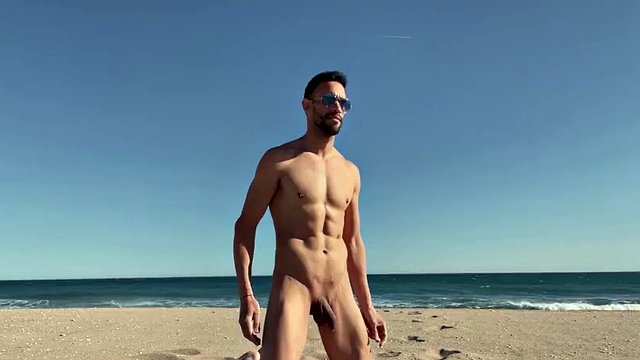Naked sexy latin man on a public beach