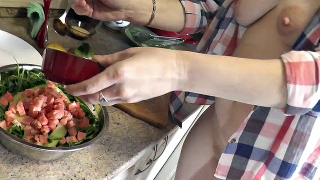 Milf sexy Platinum continues naked cooking in kitchen preparing salad for Christmas without panties  high heels. Naked in public