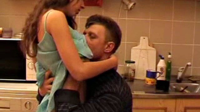 Dad And Stepdaughter In Kitchen