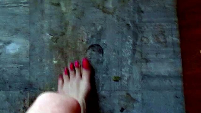 Sissy scrubs a dirty kitchen floor with spit and her feet
