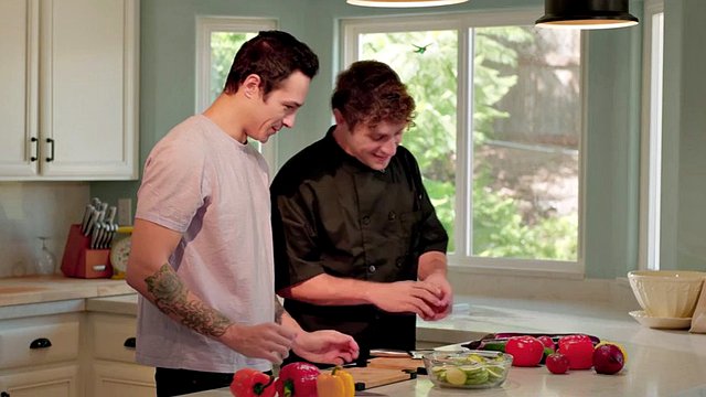Jayden Markos has fun with his cooking teacher in his room