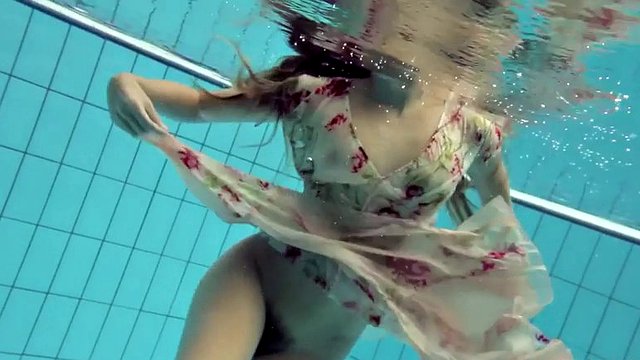 lucy takes the dress off showing her hairy pussy and titties underwater