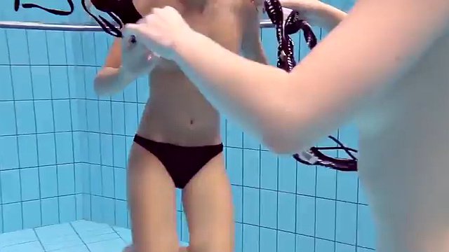 Catherine swims and undresses Lucy in the pool