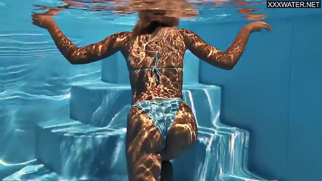Sophie Otis takes a sexy dip in the pool