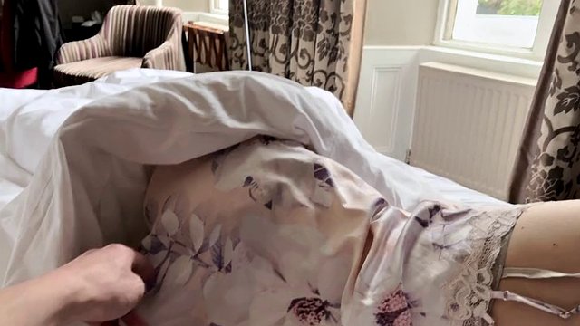 Stepmom and stepson share a hotel bed