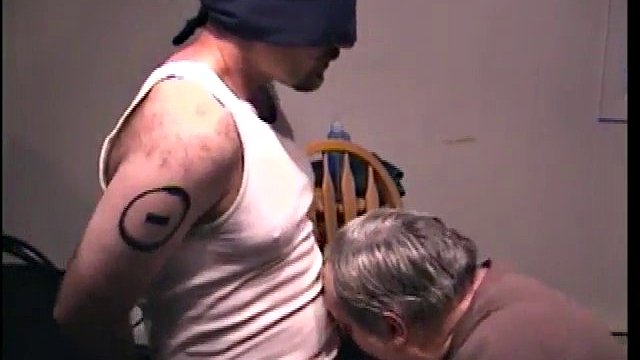 Blindfolded dude receives a blowjob from a mature twink