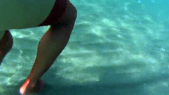 red stocking in the sea on a public beach