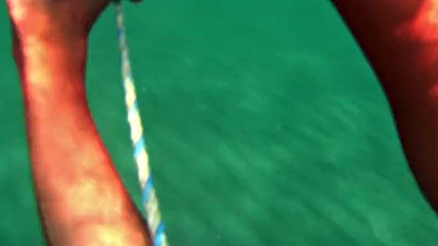 red stocking in the sea on a public beach