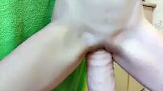 Petite MILF gets impaled on a giant monster dildo