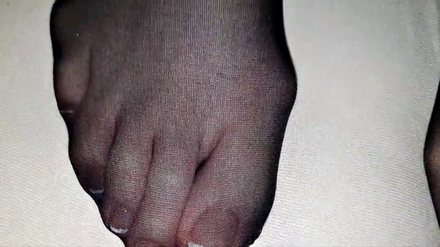 Black nylon stocking on wife's French toenails covered in detail by a big load of cum