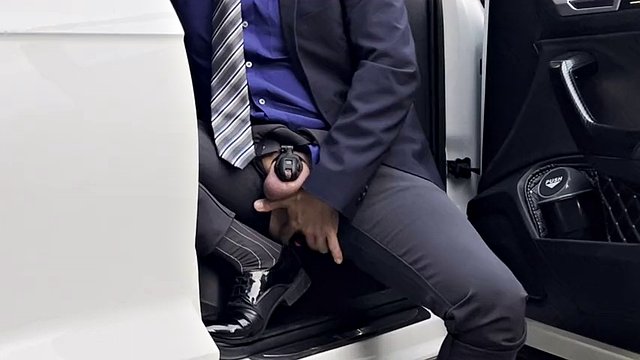 businessman is riding the dildo outdoor in public and he is cumming outside by the road