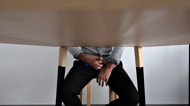 I catch my office colleague masturbating under the table and