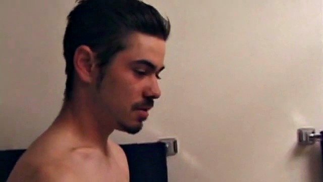 Marcus gives off a very manly impression as he sneaks into the bathroom with his laptop for some private time. He dives right into the porn he's watching and takes off his red boxers.