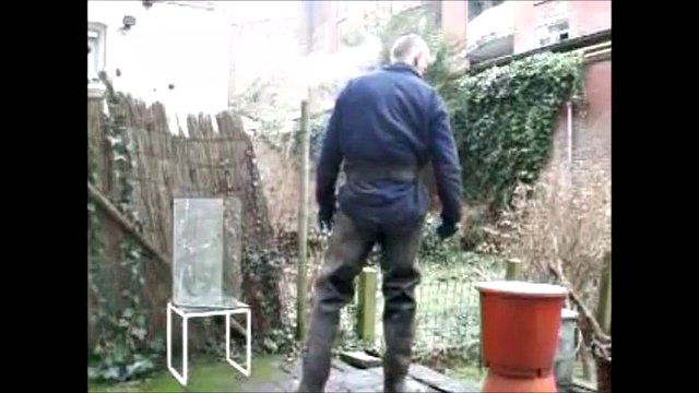 great guy in waders, rubber boots, mud and overall