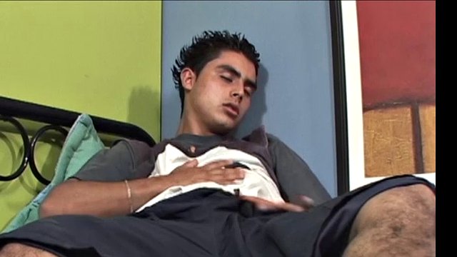 We join Latino twink Antonio, on his back and working on a stiff one. With his pants off and his shirt up, he lets his hard cock bulge out of the waistband of his underwear. Then the horny guy strips completely naked and begins. stroking with determination.