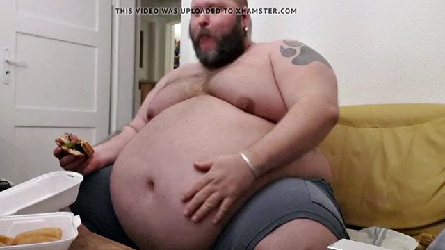 Superchubby SOC - fat guy eating a big burger and onion rings