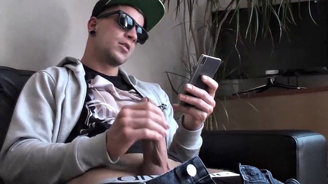 Cool guy casually shakes his cock in front of the camera and cums gigantically