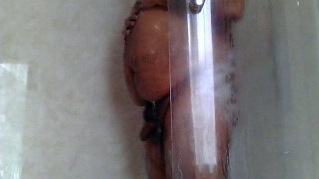Naked old guy masturbates his fat pecker while showering