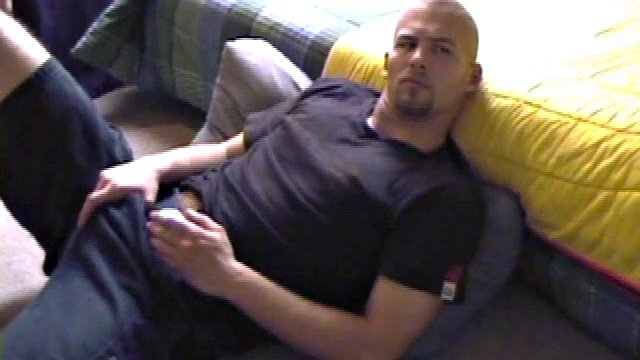 Stephen starts by unbuttoning his pants and pulling out his penis, to work on a stiff one. Naked, he lies on his back, lubes himself up and starts stroking seriously.